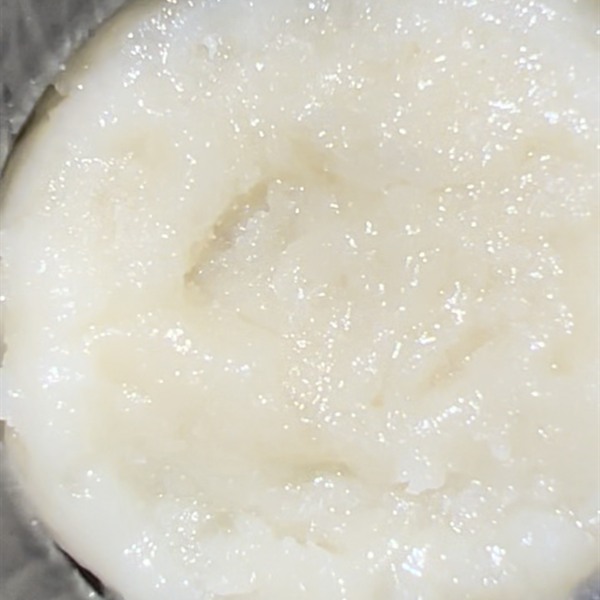 Pale rosin patty set inside a dark collection ring